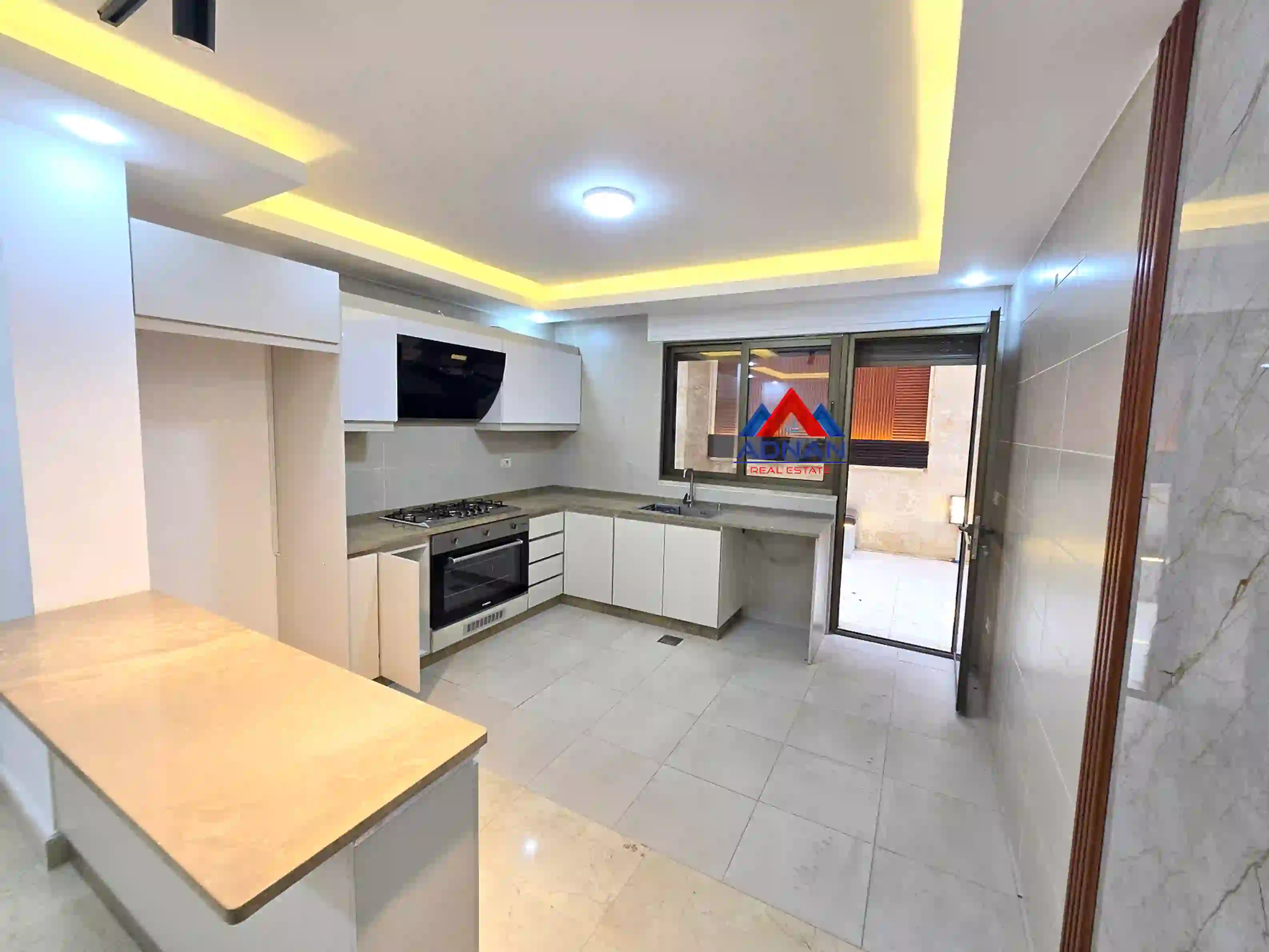 Jabal Amman - Semi-basement apartment with a distinctive terrace for rent (unfurnished, 2 bedrooms)